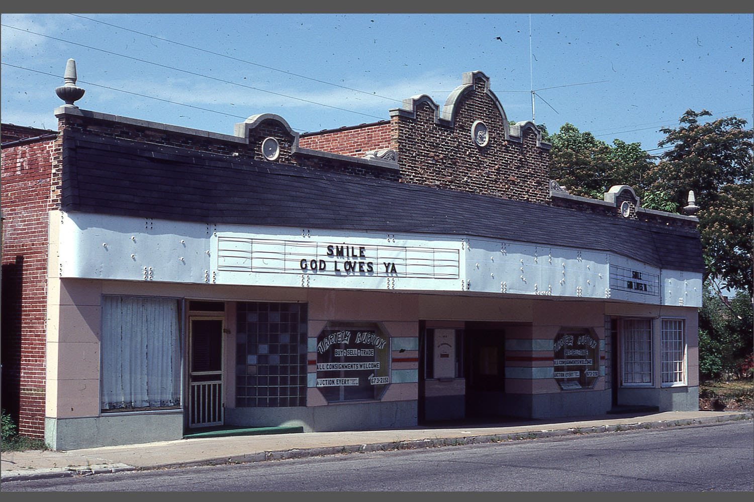 The Civic Theater building has hosted a variety of businesses over the years. It is located across from the Webb City Post Office at 215-217-219 Daugherty Street. You can barely see the top of the theater portion, which has since been demolished.