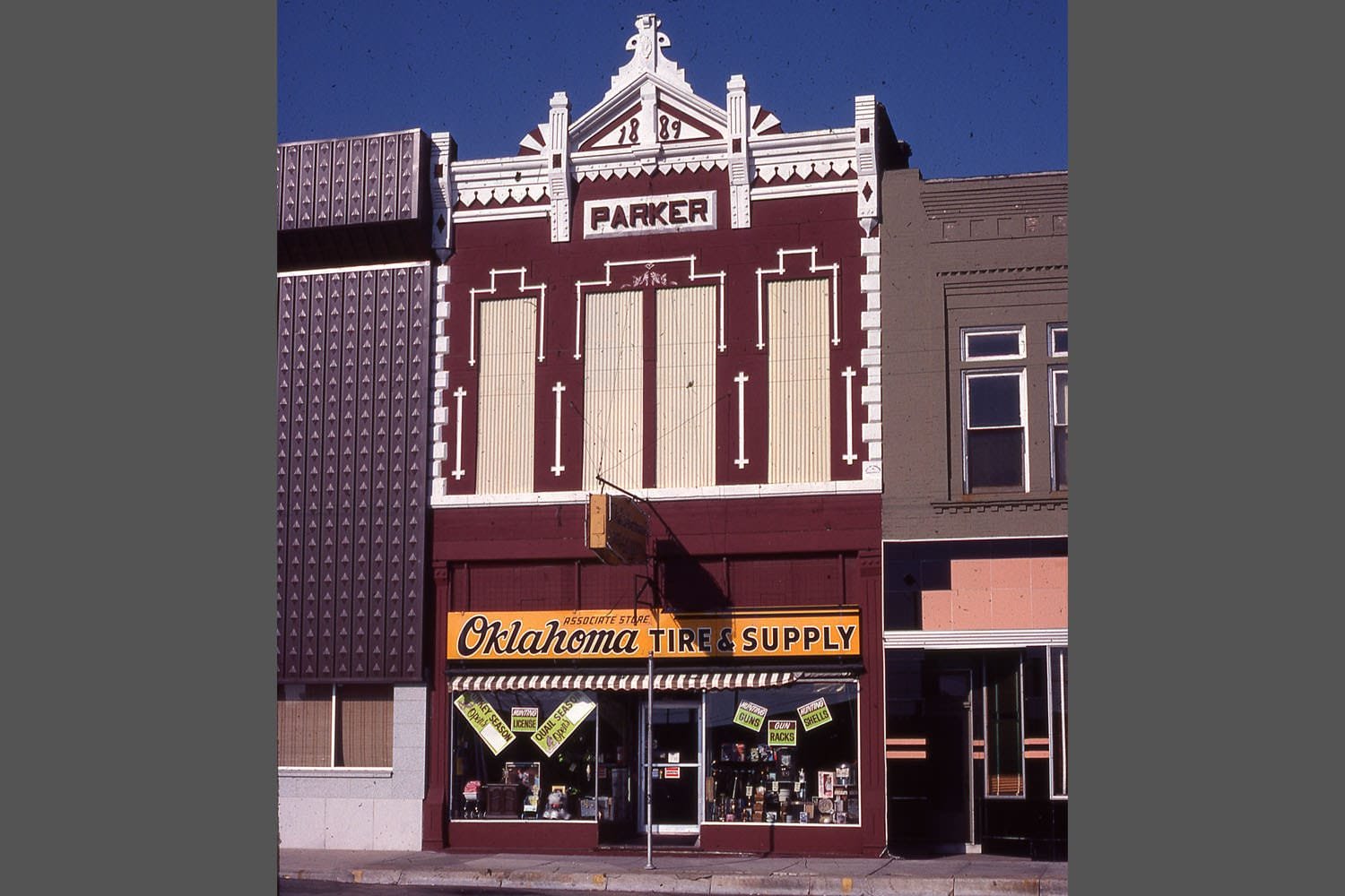 The 1889 Parker Building is located north of the former Mid-Missouri Bank building on Main Street. It housed a clothing store in the 1910s, but many residents will remember it as the location of the Oklahoma Tire & Supply store. During the 2004 remodel, the bank took over the Parker Building and built a conference room in it