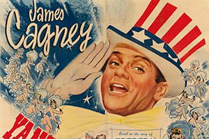 Vintage patriotic film poster showing a smiling man in a tall Uncle Sam–style hat saluting amid US flag graphics and patriotic imagery.
